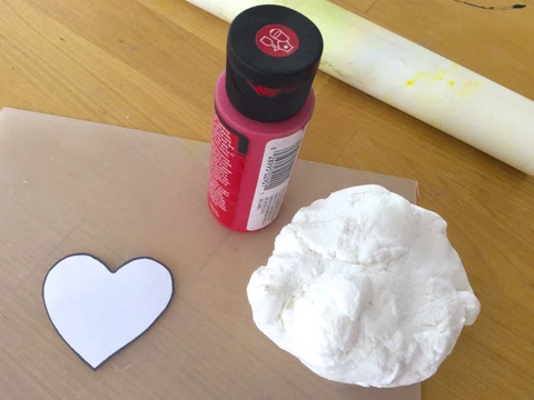 Making air dry clay Sacred Heart magnets is fun.